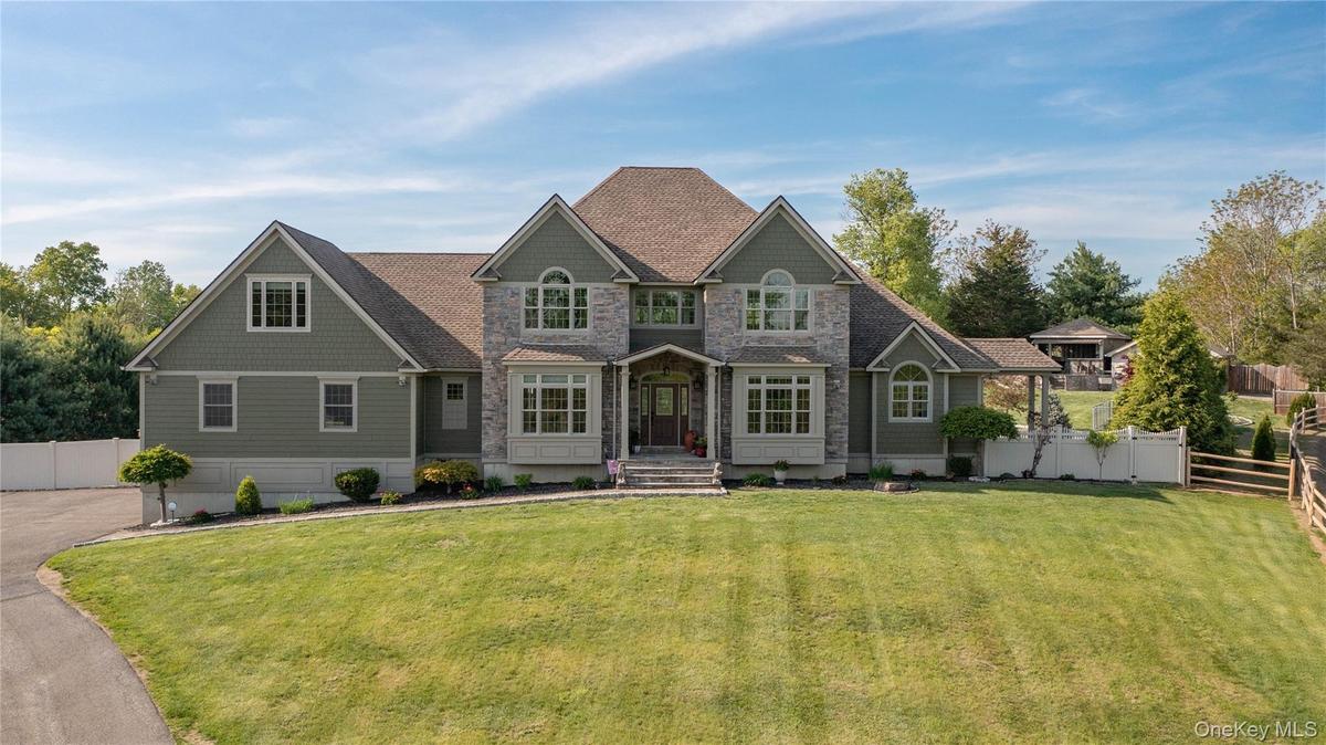Builder's own home with Hardie plank and stone siding accents - immaculately maintained.