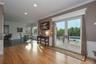 Living room flows seamlessly to an informal dining area and open kitchen - all overlooking the manicured grounds.