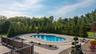 Extensive space to gather, entertain and lounge. Lighted, heated pool with fountain.