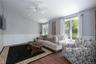 Living room flooded with natural light, gleaming floors, ceiling fan, recessed lighting and outside access to flexible covered patio or carport.