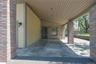 View of patio / terrace with a carport and landscaped side yard.