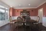 Formal dining room with great natural light, wainscoting, ornamental molding and wood finished floors