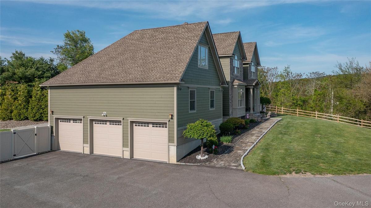 Oversized 3-car, heated garage with vaulted ceilings.