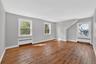 Unit #2-Bright living room with large windows and an open feel.