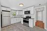 Unit #2-Well-appointed kitchen blending style and practicality.