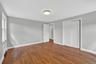Unit #2-Spacious primary bedroom offering a calm, comfortable retreat with generous closet space.