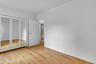 Hardwood flooring throughout this bright room