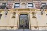 Ornate entry with decorative wrought iron double doors