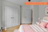 White paneled bifold doors with brushed nickel hardware, light wood-finish flooring, and light gray painted walls