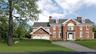 Colonial-style house with driveway, a chimney, and a front lawn