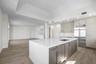 Kitchen overlooking dining room and living room