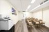 Commercial space featuring wood-finish flooring, recessed lighting, and white walls