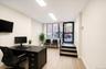 Interior space featuring light wood-finish flooring, white walls, and recessed lighting