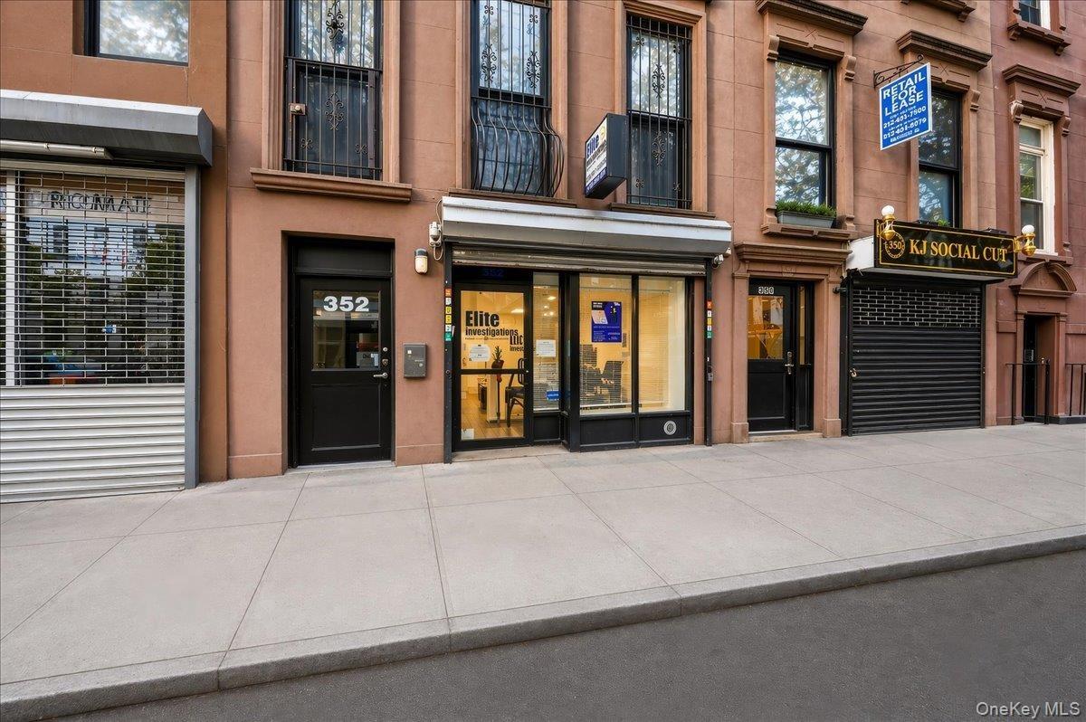 Street-level storefronts with large display windows and direct street access