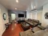 Living area featuring wood-finish flooring, recessed lighting, and an archway leading to an interior space
