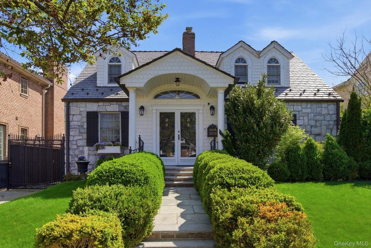 Elegant double door entry into a entry closeted foyer