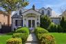 Elegant double door entry into a entry closeted foyer