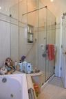 Full bath with a stall shower, a jetted tub, and tile patterned flooring