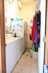 Washroom featuring light tile patterned floors and separate washer and dryer