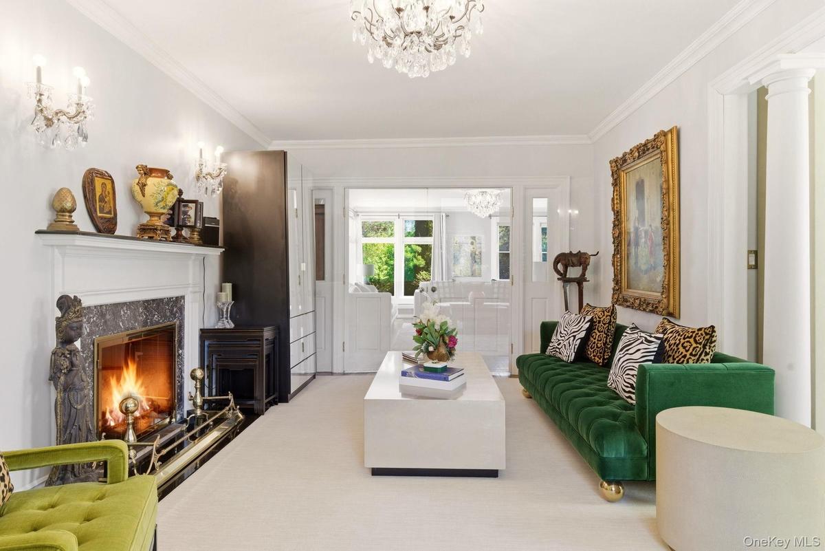 elegant crown moldings, hardwood floors, chandeliers