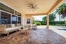 Oversized Patio with travertine marble flooring