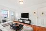 Virtual Staged Living room featuring hardwood / wood-style floors and baseboards