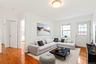 Virtual Staged Living area with light wood-type flooring and baseboards