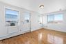 Foyer featuring a baseboard radiator, light hardwood / wood-style floors, and a healthy amount of sunlight
