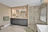 DUAL SINKS, SHOWER WITH UPDATED GLASS AND SOAKING TUB