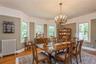 Formal dining room, complemented by a cast iron radiator and a classic chandelier