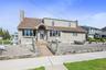 Front of house has 2 huge driveways