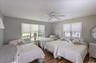 Bedroom featuring wood-finish flooring and neutral wall tones