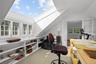 Artist's studio with skylight and adjacent painting atelier