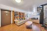 Living room with stairway and wood finished floors