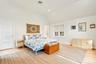 Expansive room with a large walk in closet and pretty views over the back yard and pool.