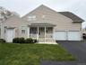 Welcome to 19 Meadow Pond Ct., a covered front porch, 2 car garage, 3 extra spaces to park, plus 3 guest spaces on the street!