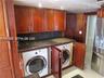 Full Washer Dryer, neatly hidden in Custom Cabinetry!