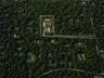 Elevated aerial overview showcasing the estate’s private wooded setting, defined flag-lot orientation, and secluded drive from Oakview Highway within 