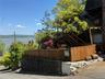 Cedar Fence, flowering vine atop stairs.