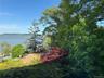 Showing River and flowering trees.