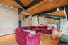 Living room featuring track lighting, wood finished floors, wooden ceiling, and baseboard heating
