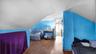 Bedroom featuring wood finished floors and vaulted ceiling