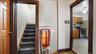Stairway featuring baseboards and tile patterned floors