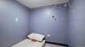 Bedroom with baseboards and light tile patterned floors