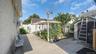 Fenced backyard featuring a patio, a shed, and a pergola