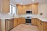 The heart of the home is a designer kitchen with quartzite countertops, & stainless-steel appliances