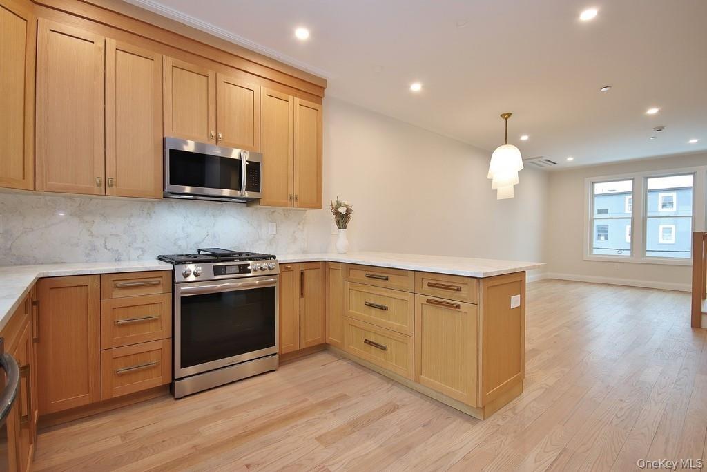 This sleek & stylish kitchen is a chef's dream, providing ample storage & workspace for all your culinary adventures.