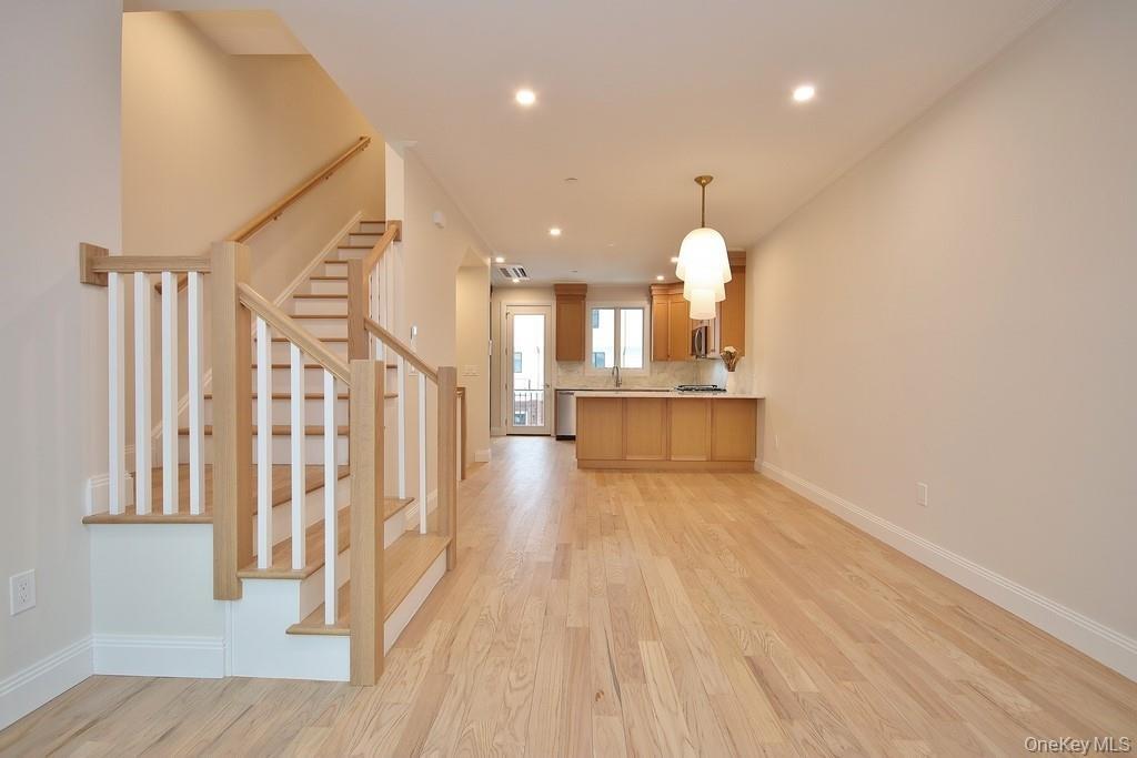 Another view of the living room, dining area & kitchen