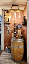 Bar area featuring brick wall and wood finished floors