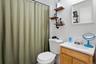 Bathroom with vanity and a shower with shower curtain